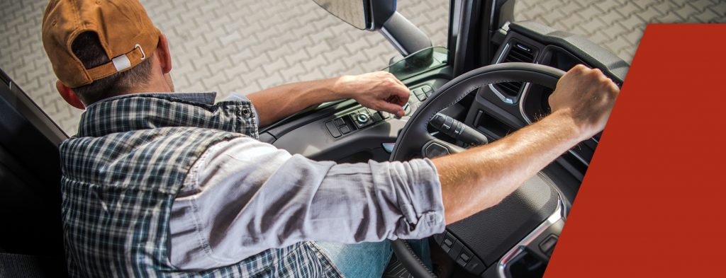 Parked driver leaning out window while learning how do you become a truck driver
