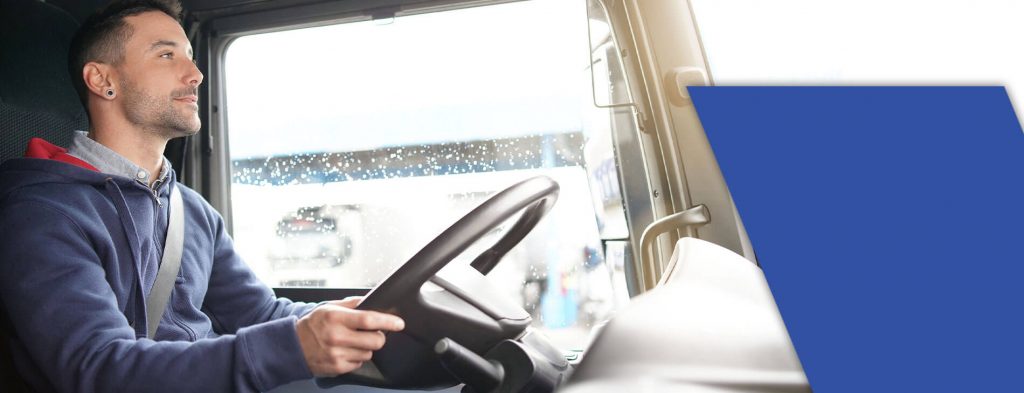CDL student behind the wheel of a truck after taking CDL night classes.